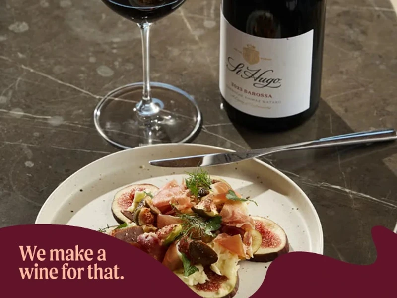a plate of food and a bottle of wine