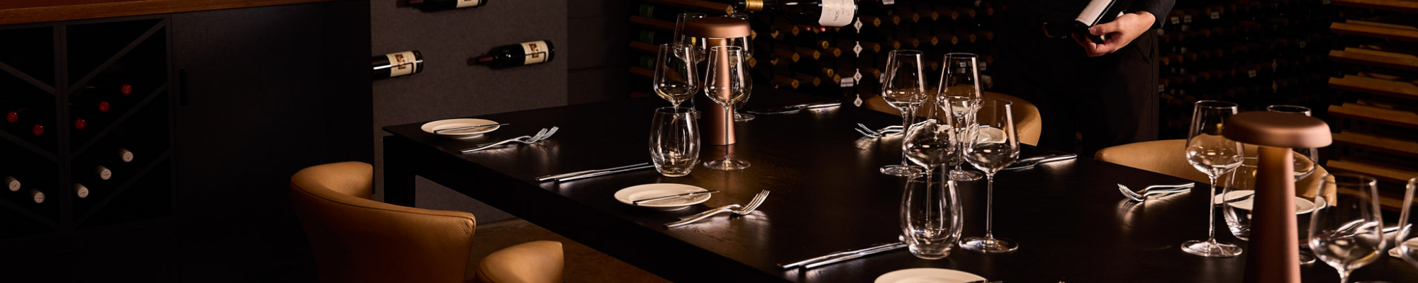 a wine glasses and plates on a table