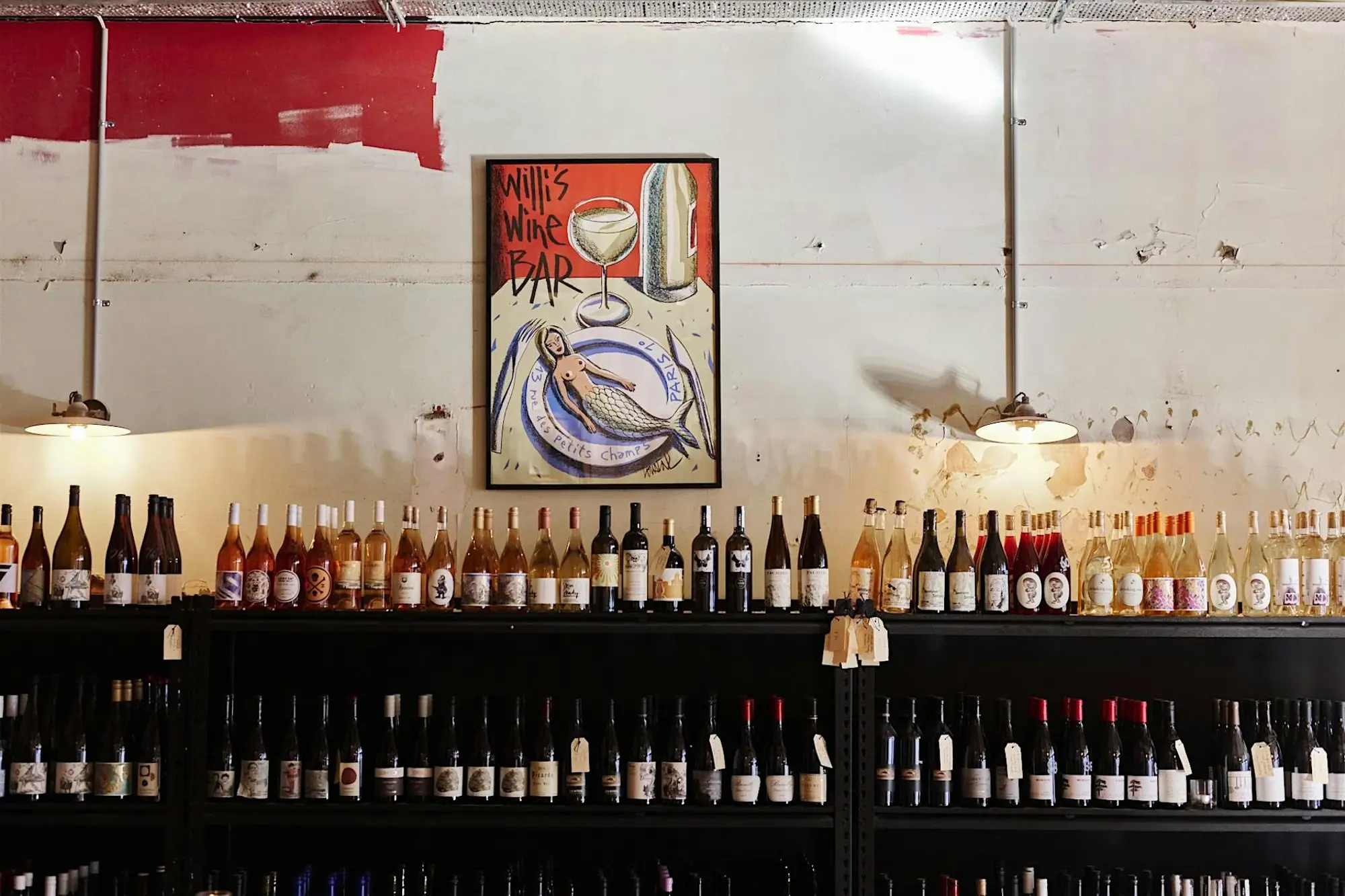a shelf with bottles of alcohol on it