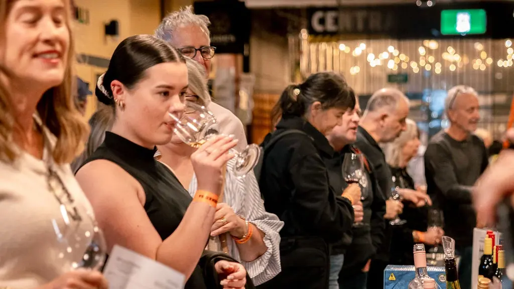 a woman drinking wine in a line