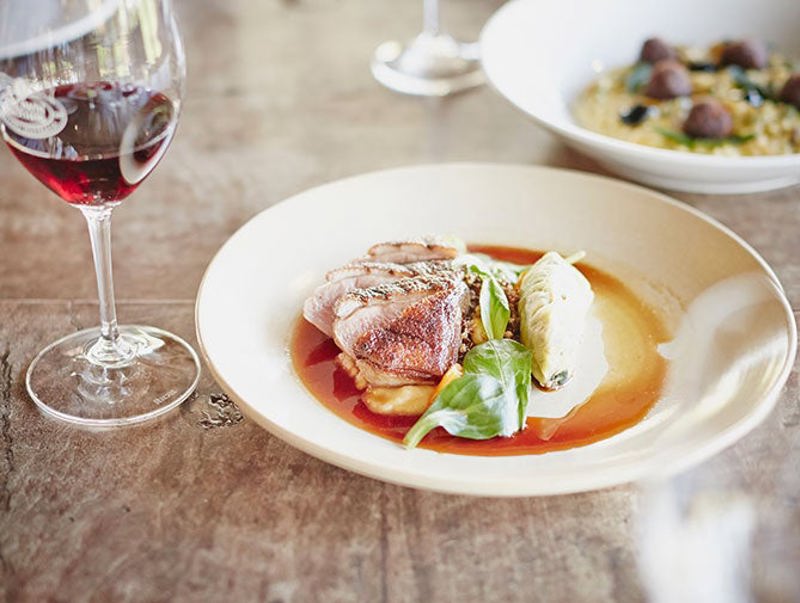 Red wine with plate of food