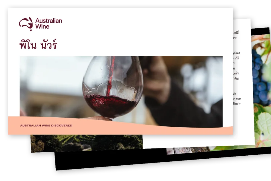 a person pouring wine into a glass