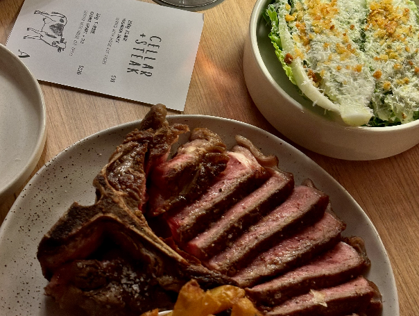 a plate of meat and salad