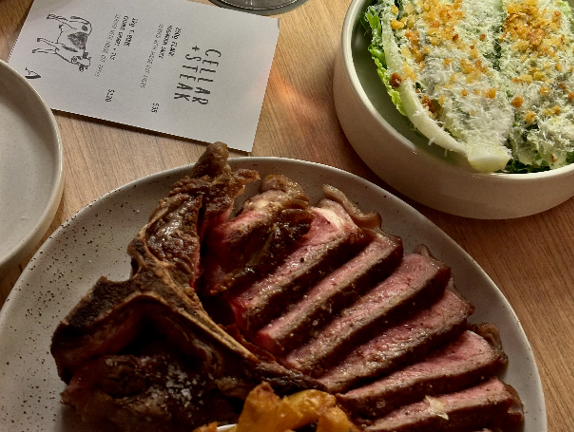 a plate of meat and salad