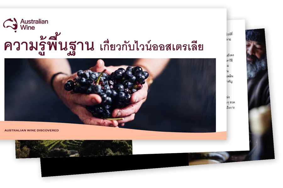 a person holding a bunch of grapes