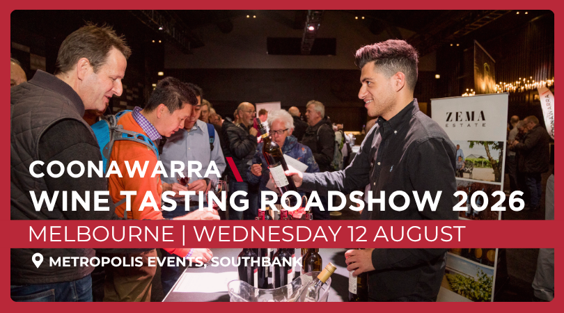 a group of men at a wine tasting event