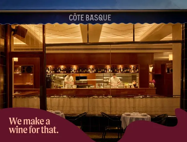 a restaurant with a chef behind the window