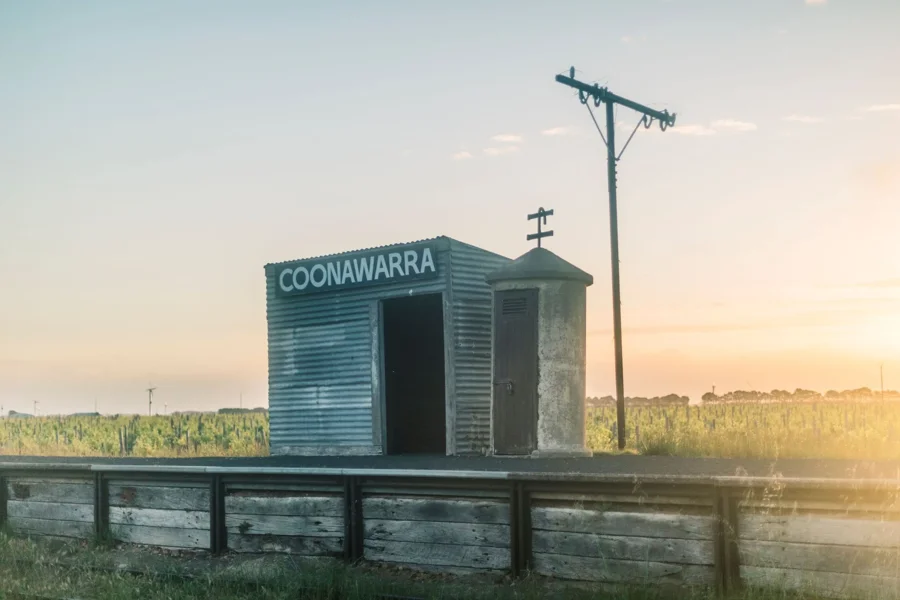 a small building next to a telephone pole