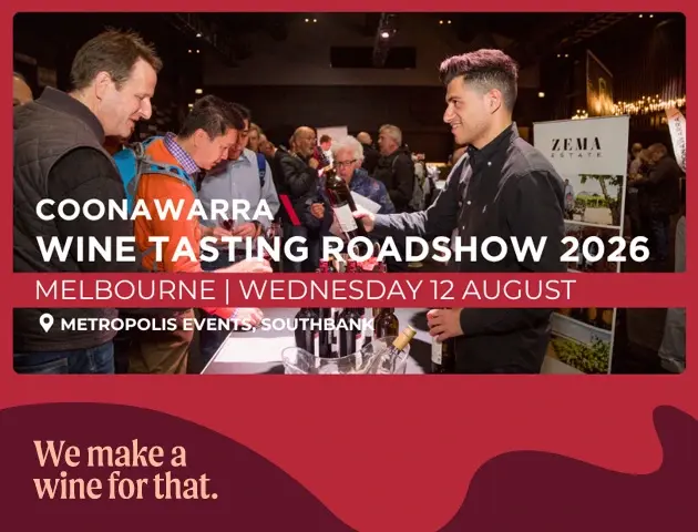 a group of men at a wine tasting event