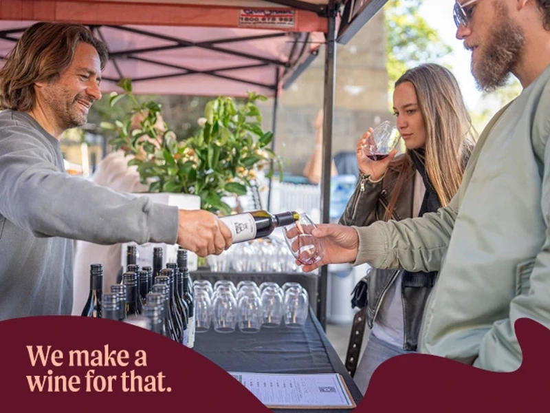 a man pouring wine into a bottle
