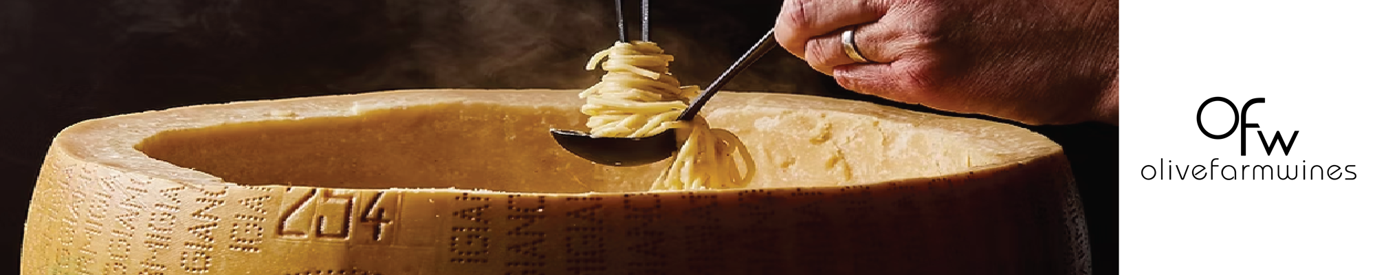 a person holding a spoon with noodles