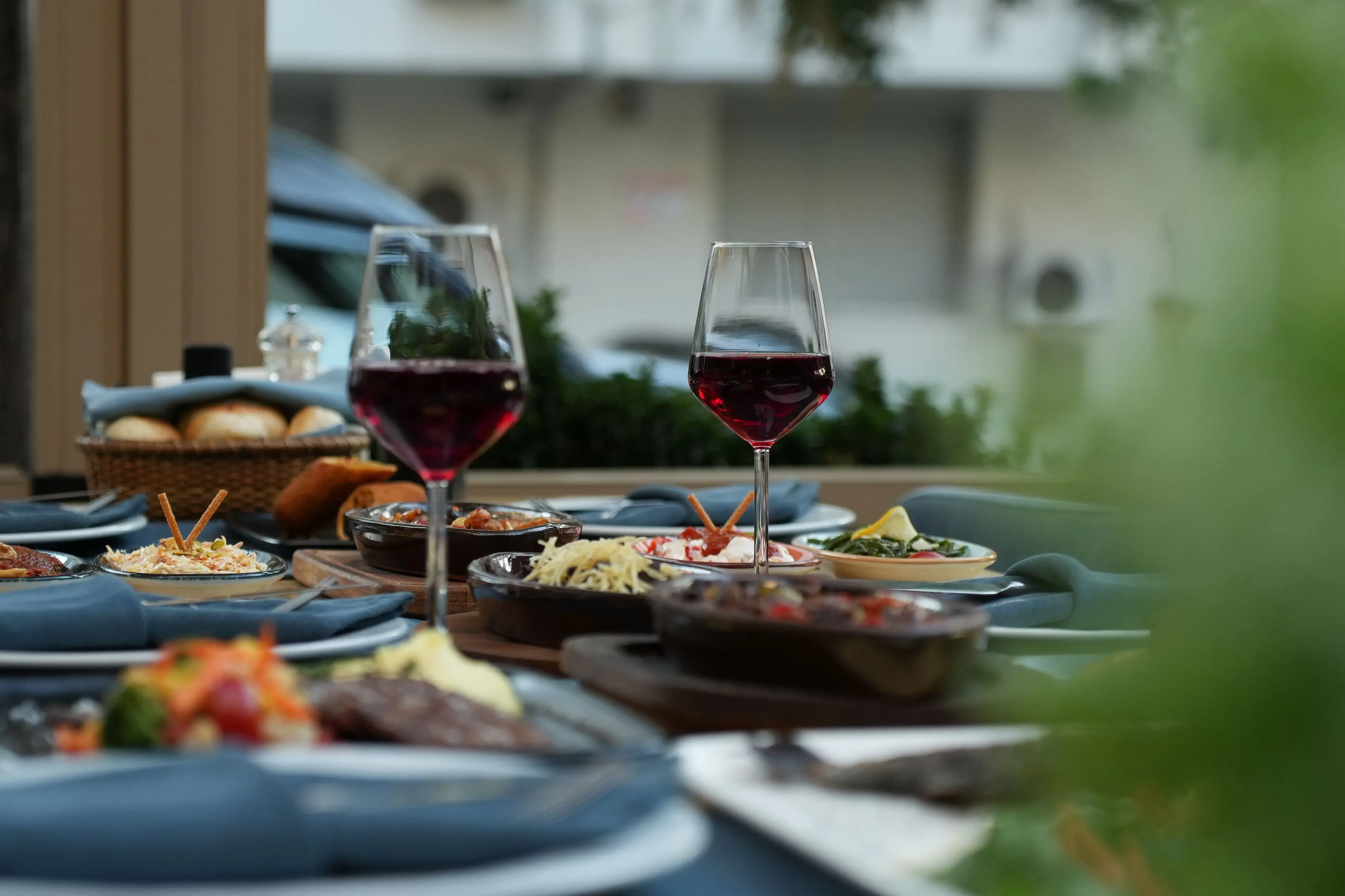 a table with food and wine glasses