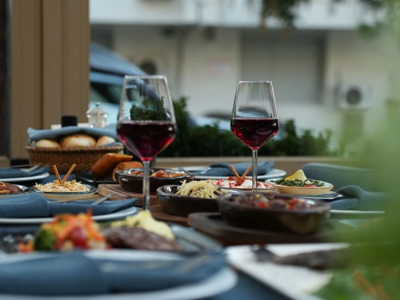 a table with food and wine glasses