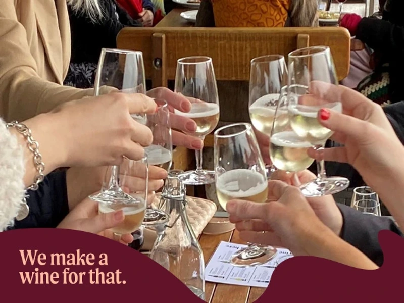 a group of people holding wine glasses