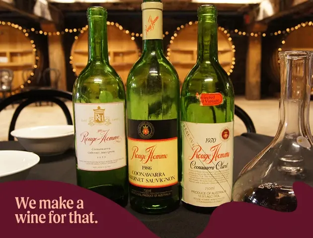 a group of wine bottles on a table