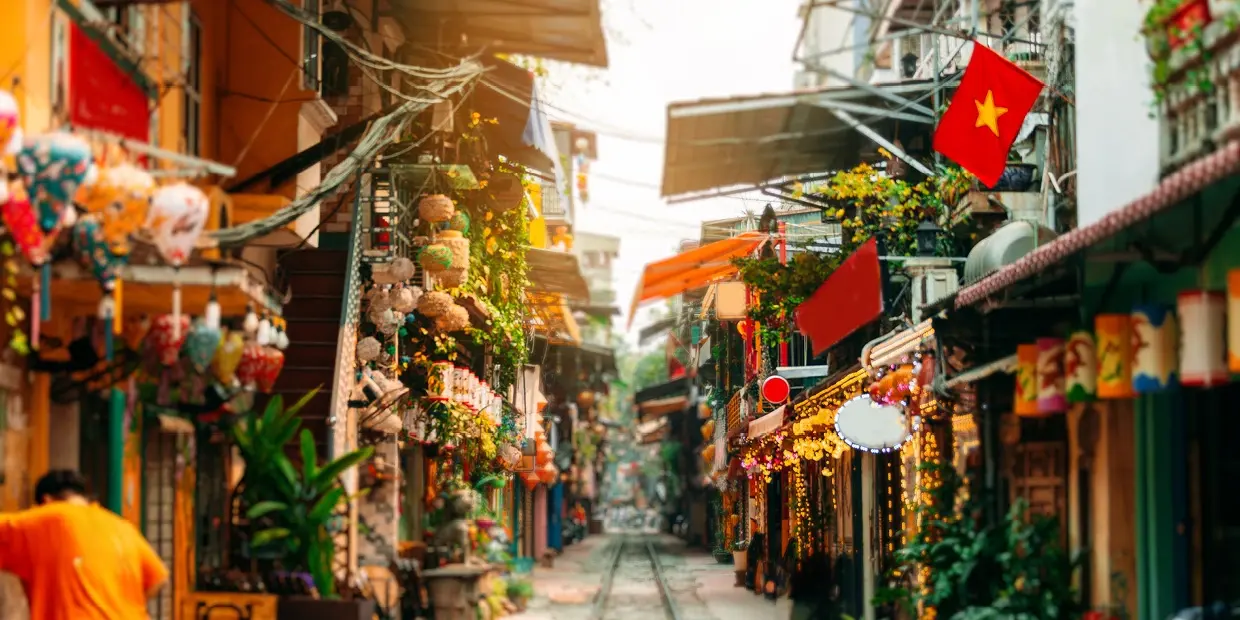 a street with buildings and plants