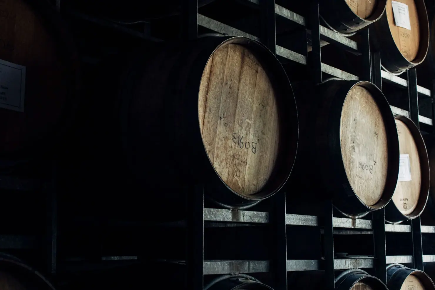 a group of barrels on a shelf