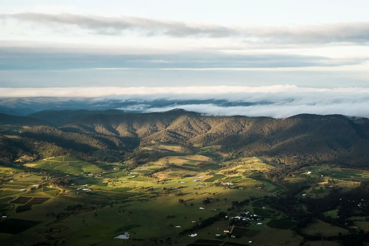 a landscape with clouds and mountains