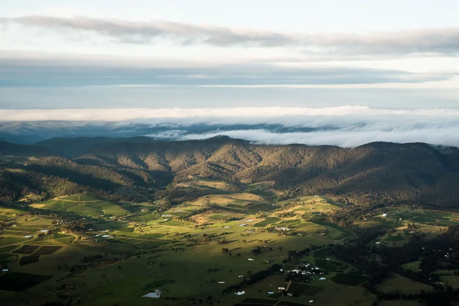 a landscape with clouds and mountains