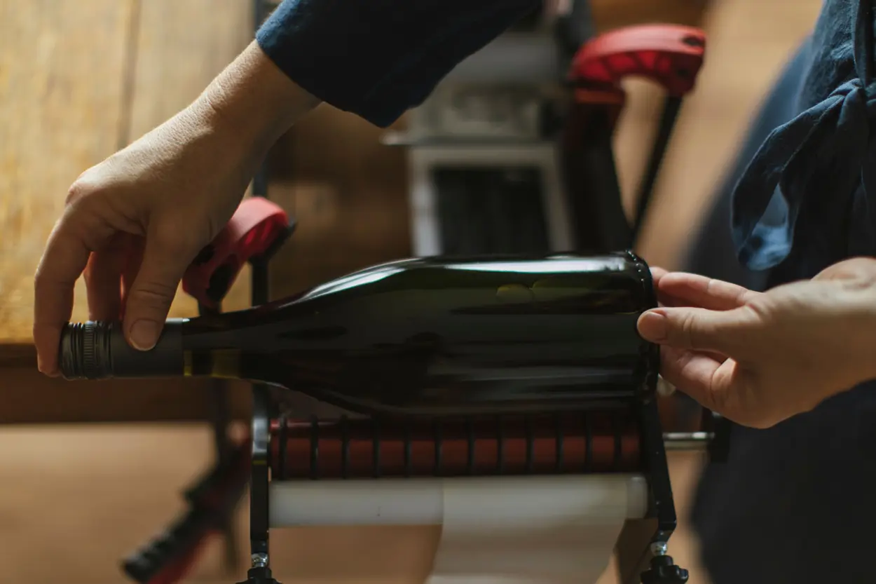 a person holding a bottle