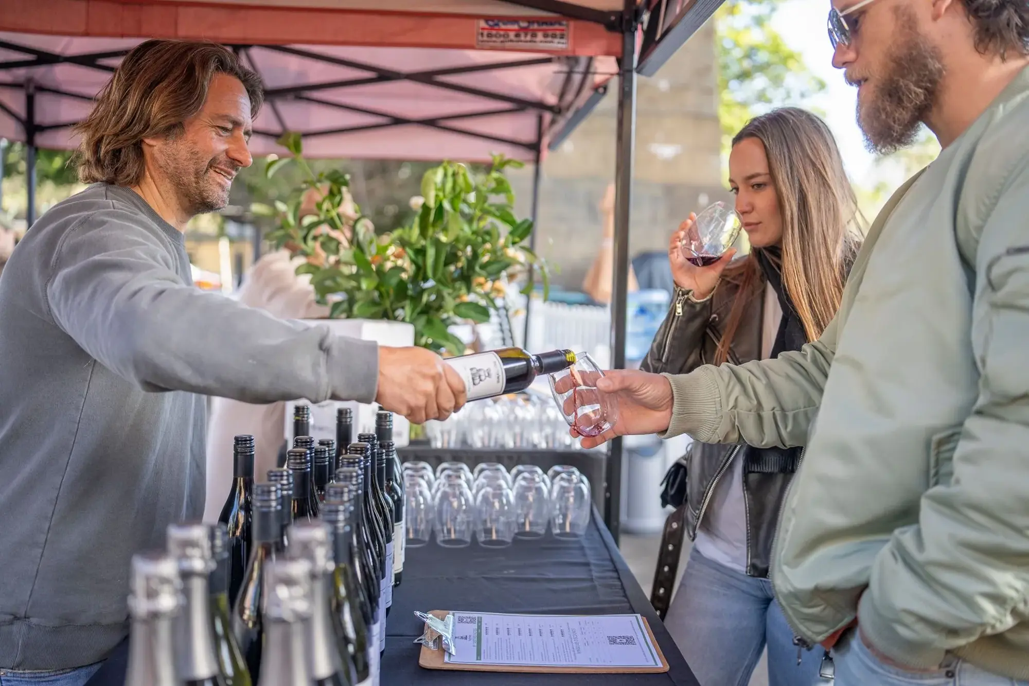 a man pouring wine into a glass