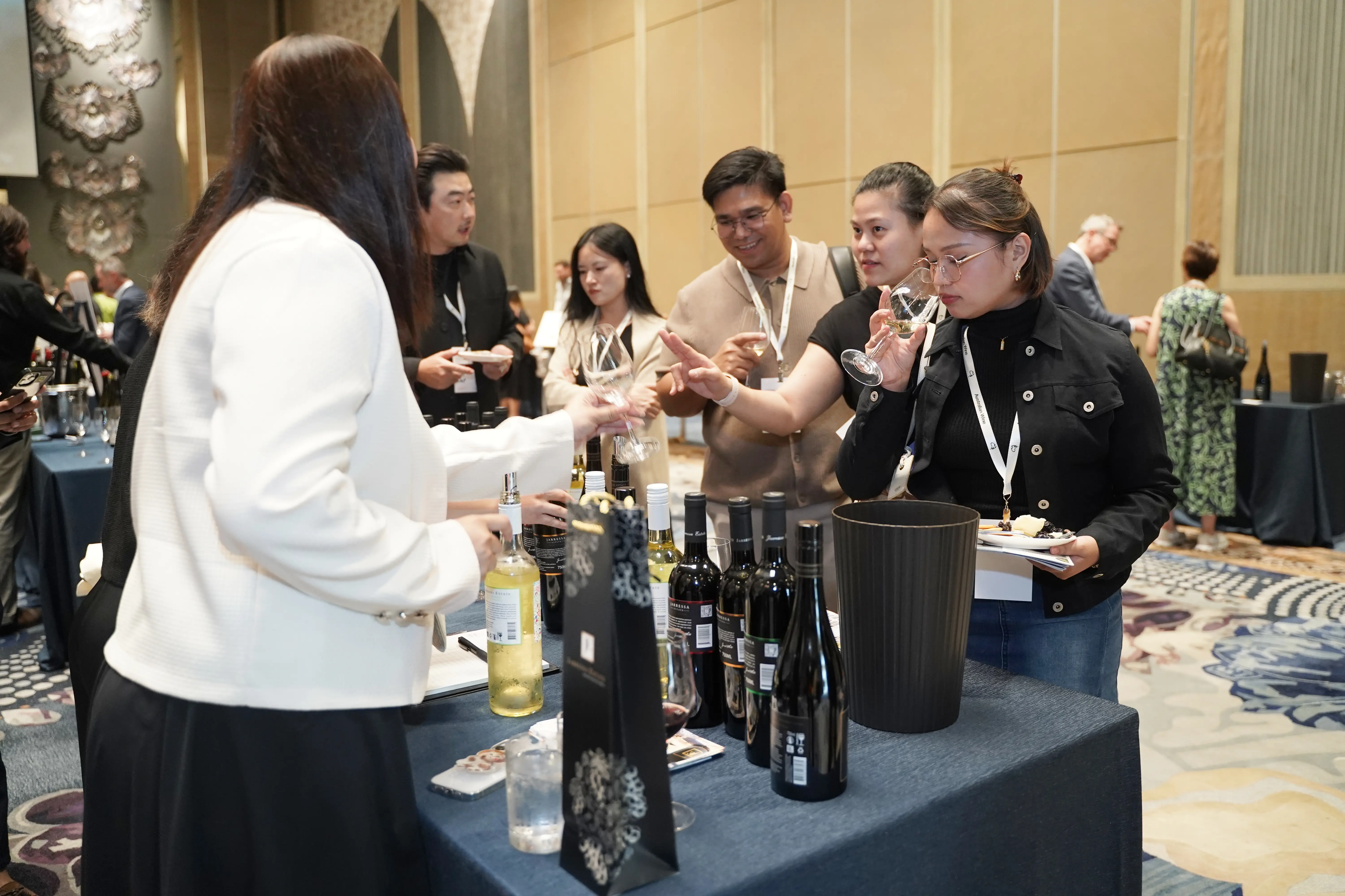 a group of people at a wine tasting event