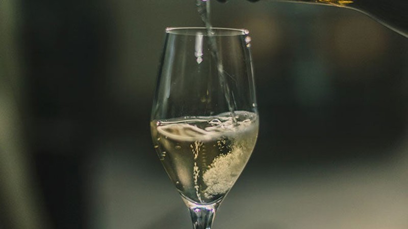 Sparkling wine pouring